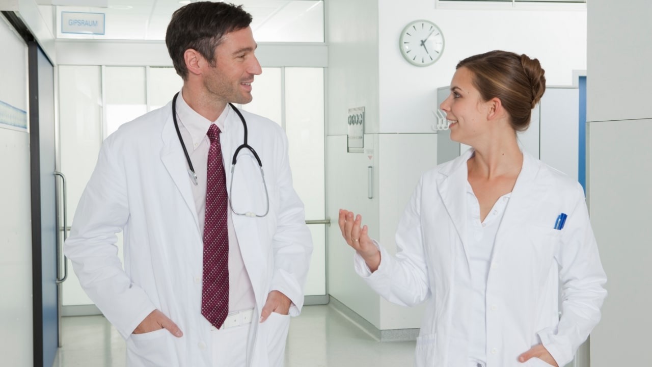 Two doctors discussing about the clinical trials.