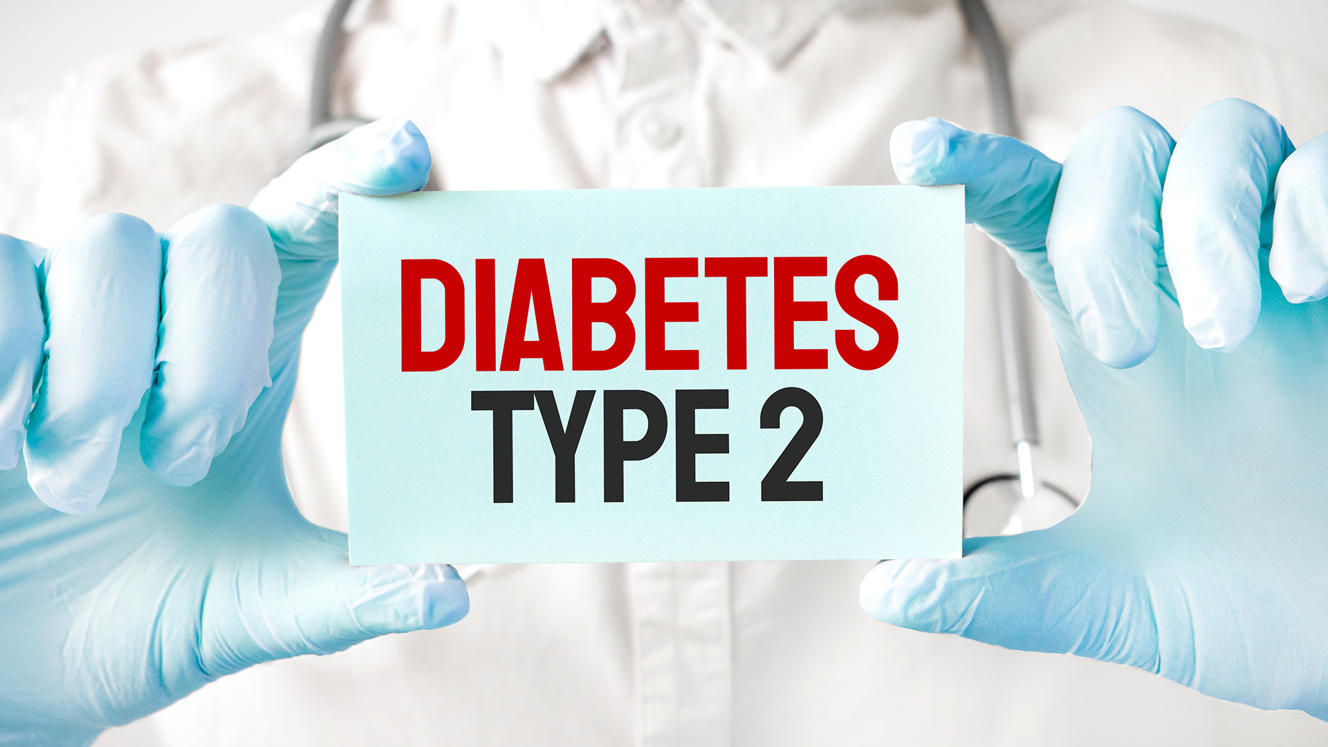 Doctor holding a diabetes type 2 sign for patients to join a clinical study